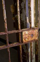 Old rusted gate at the famous landmark Alcatraz Prison on bay island in San Francisco California