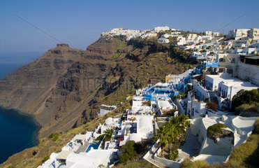 Santorini Greece and the beautiful white buildings on the mountain cliffs of main city of Fira