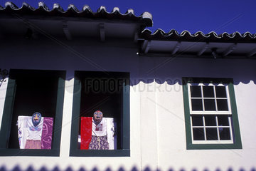 Puppets in the window during Carnival  historic centre of Parati city  in Rio de Janeiro State  Brazil. Colonial architecture  popular culture  popular party.