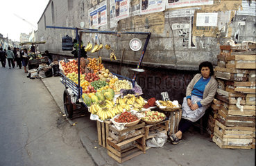 Peru  Woman selling fruits on the street.