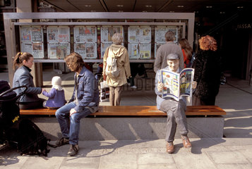 Norway  Oslo. Reading the news.