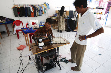 Maldives  man behind sewing machine