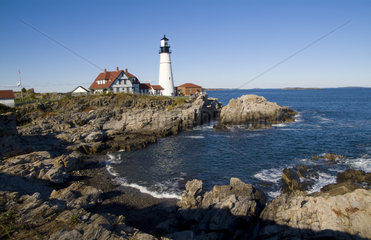 Famous Portland Head Light lighthouse in Portland Maine in bright sunshine sunny day