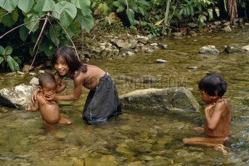 Mentawai children bathing in the river Siberut Sumatra