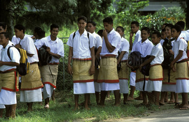 Tonga  school children waiting for transportation