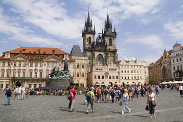 Sunny day with crowds of tourists in famous Old Town of tourist city of Prague in Czech Republic
