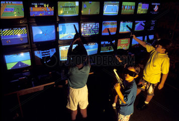 Sao Paulo  Brazil. Middle-class children at electronic games ( video games ) center ( 1990 ).
