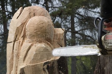 Craftsman carving wood with the slicer Bourgogne France