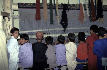Children weaving carpets  Kabul - Afghanistan