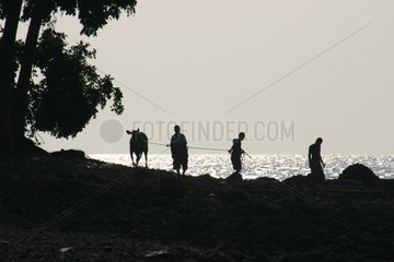 Pastors on the Flores sea shore Indonesia