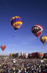 Colorful abstract of hot air balloons in the air in Albuquerque New Mexico at the largest balloon festival in the world called Paint the Sky
