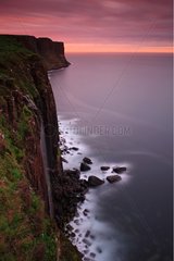 Kilt Rock waterfall at dusk Isle of Skye Scotland