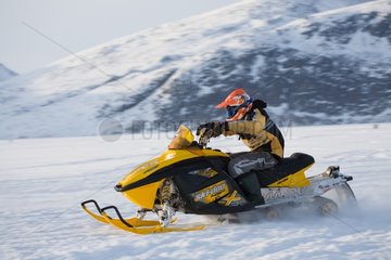 Snowbike on Pangnirtung fjord Canada
