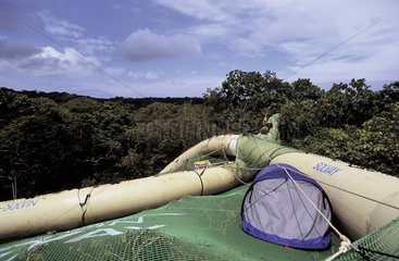 Blimp-borne inflatable raft on canopy Panama