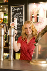 Beautiful barmaid at the PIVO Cafe Pub on Corn Exchange street in Stirling Scotland