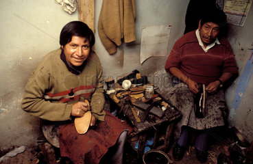 Peru  Portrait of shoemakers at work in the workshop.
