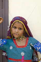 Young girl age 6 in traditional costume dancing with jewelry in Agra India