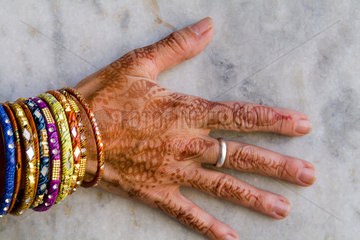 Colorful Henna design on womans hands artwork for celebration tatoos in Delhi India