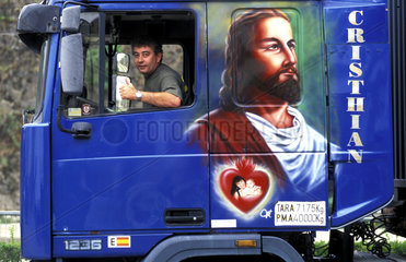 Valencia  a truck decorated with a painting of Jesus
