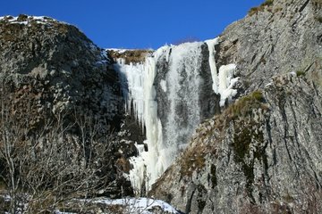 Deroc waterfall frozen in winter Aubrac France