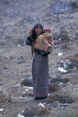 Woman carrying her infant Bhutan
