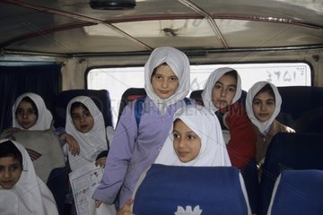 Young girls iranniennes in a school bus