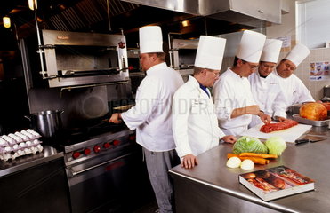 Chefs learning in school to cook andf prepare food