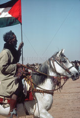 WESTERN SAHARA : Polisario supporter at a political rally in the desert.