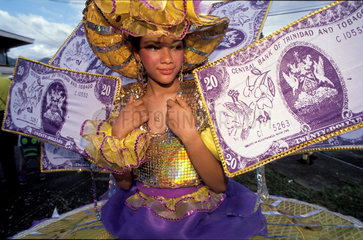 10025943 Trinidad girl has dressed with bank notes of Trinidad during carnaval in Port of Spain photo: Trygve Bolstad/Lineair