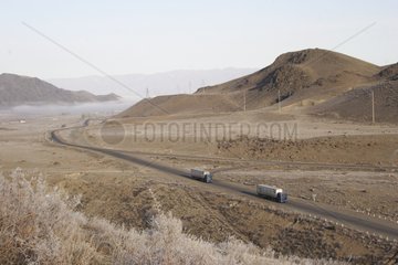 Chinese trucks on the road to the lake Issy Kul Kyrgyzstan