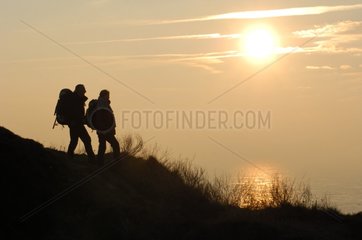 Hikers at sunset at Cap-Gris-Nez Calais France