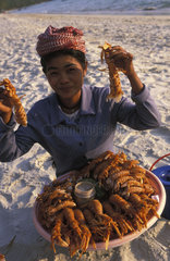 Sihanoukville  selling seafood on Ochheutal beach