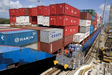 Container ship running the Gatun locks Panama Canal