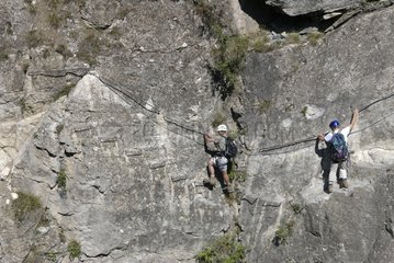 Men on a via ferrata trail Savoie France