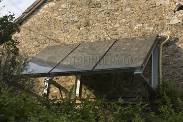 Solar panels on an old house stone wall