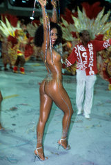 Mulata Globeleza  Valeria Valensa  Samba Schools Parade  Rio de Janeiro  Brazil. sensuality  dark-skinned woman  nude  dancing  dancer  buttock  back.