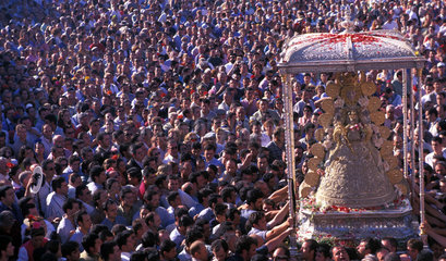 El Rocio the crowd of the pilgrims is watching the Holy Virgin in awe