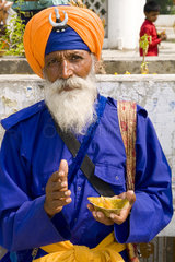 Portrait of colorful Sika Hindu religious man in famous Bangla Shib Gurudwara Sika Great Temple in New Delhi India