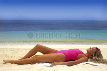 Woman 30s relaxing and having fun at beach on vacation in Caribbean Mexico
