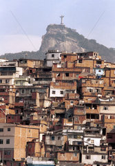 Morro da Coroa ( Coroa slum ) at Santa Teresa quarter  Rio de Janeiro  Brazil. Christ the Redeemer and Corcovado in the background.