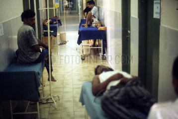 Latin America. Public hospital - Patients being in attendance in the corridor.