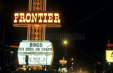 Gambling at the Frontier Hotel in the desert exciting Las Vegas Nevada at night with all the neon lights and energy in the USA