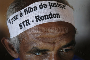 Demonstration for land reform in amazon  Brazil. One-eye blind half-breed landless worker wears forehead strip saying: A Paz é filha da Justiça ( Peace is justices daughter ) STR - Rondon ( Sindicato dos Trabalhadores Rurais de Rondon do Pará - Rural Wor