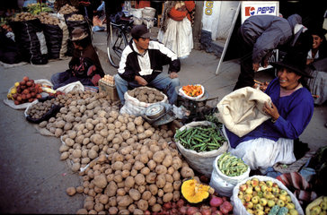 Peru  People selling potatoes and vegetables on the market.