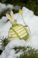 Small iron rabbit in the snow at Easter in Provence