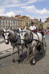 Beautiful colorful architecture and horse drawn carriage in the famous Old Town in Prague Czech Republic