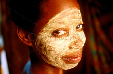 A Macoa girl with a facemask from the juice of a root. Ilha de Mozambique.