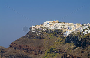 Santorini Greece and the beautiful white buildings on the mountain cliffs of main city of Fira
