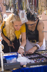 Shoppers looking at jewelry ands at market in Andres Street at Klovskiy Spusk downtown in Old Town Kiev Ukraine