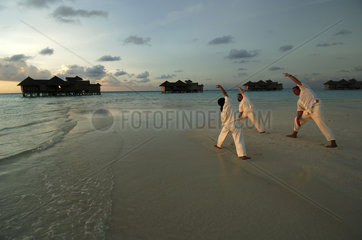 Maldives  yoga class on the beach of the Sonevagili resort